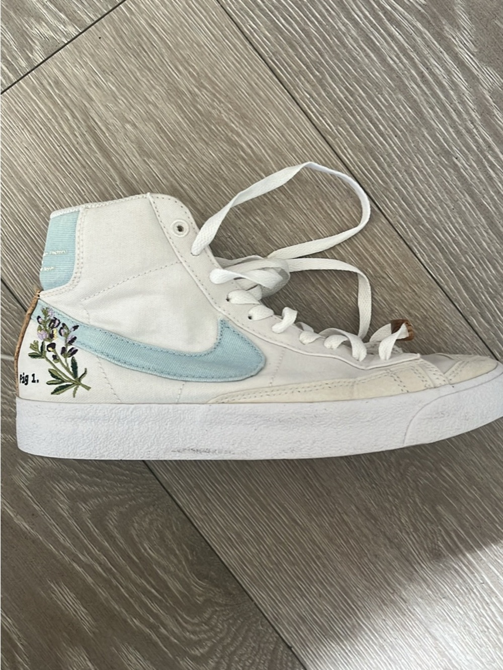 Nike Women’s Mid-Top Sneakers in White with Light Blue Swoosh and Floral Heel